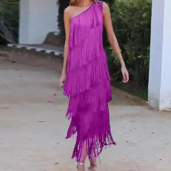 Jurken & Jumpsuits Dames*Carol - Modieuze één-schouder zomerjurk met kwastjes